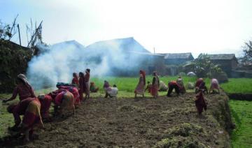 Women’s communal work group preparing a field for off-season vegetables in Western Nepal. Photo Krishna Adhikari